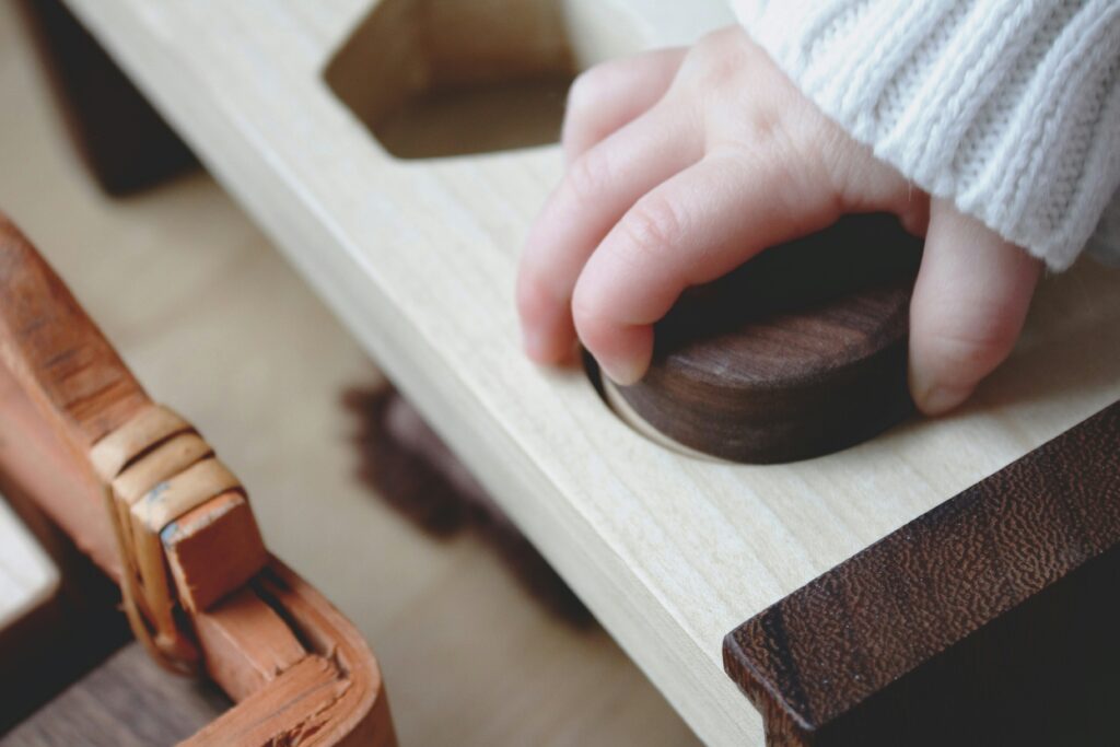 Montessori work child playing with a Montessori toy