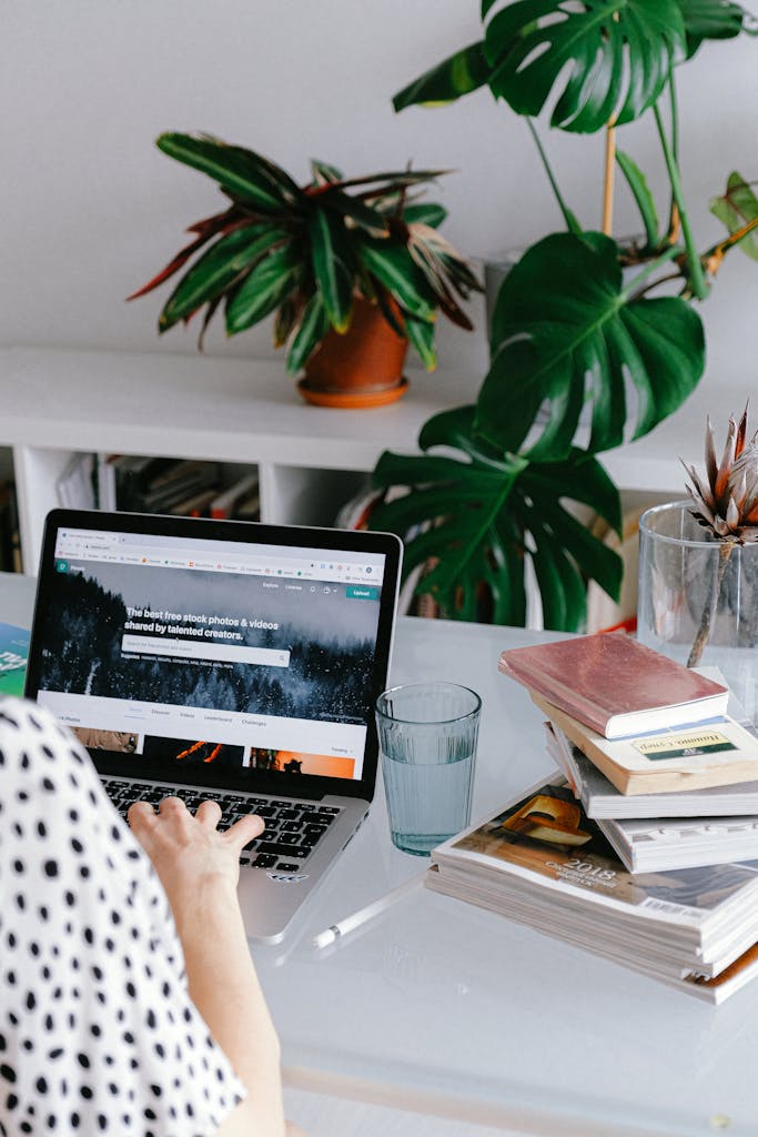 person working at desk on computer