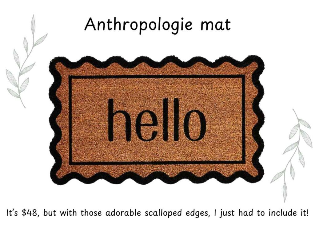 Anthropologie doormat with scalloped black edges