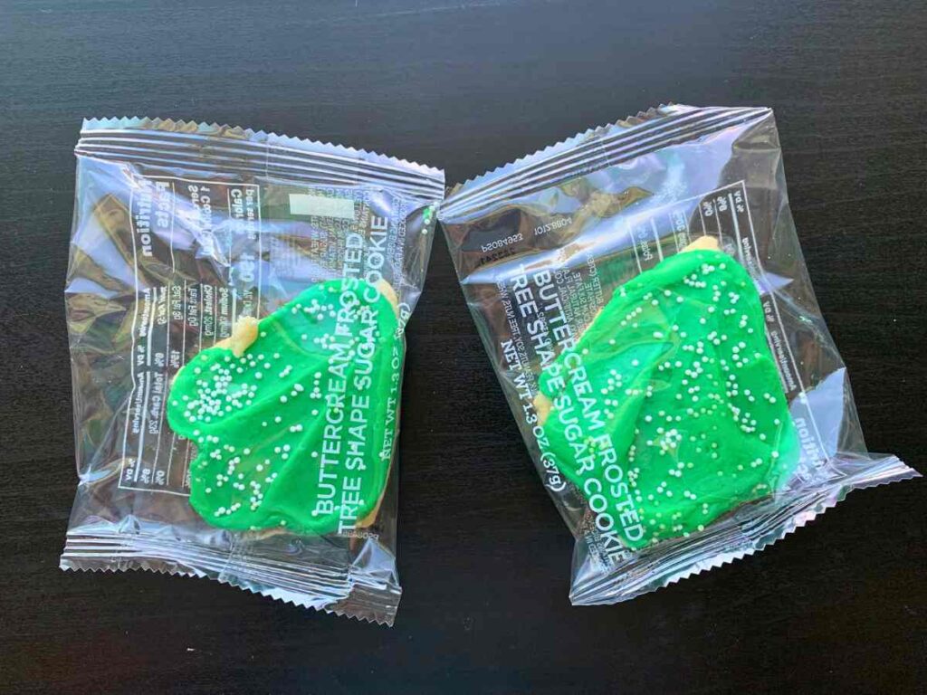 Free cookie, buttercream frosted tree shape sugar cookie with green icing