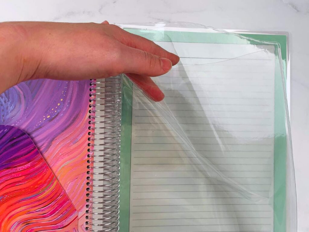 The clear folder at the back of the planner