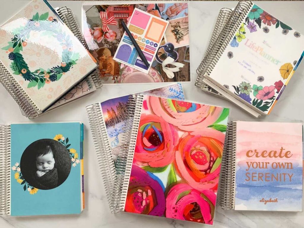 A picture of many Erin Condren planners including multiple copies of their Life Planner, the Daily Duo, and the Teacher Lesson Planner