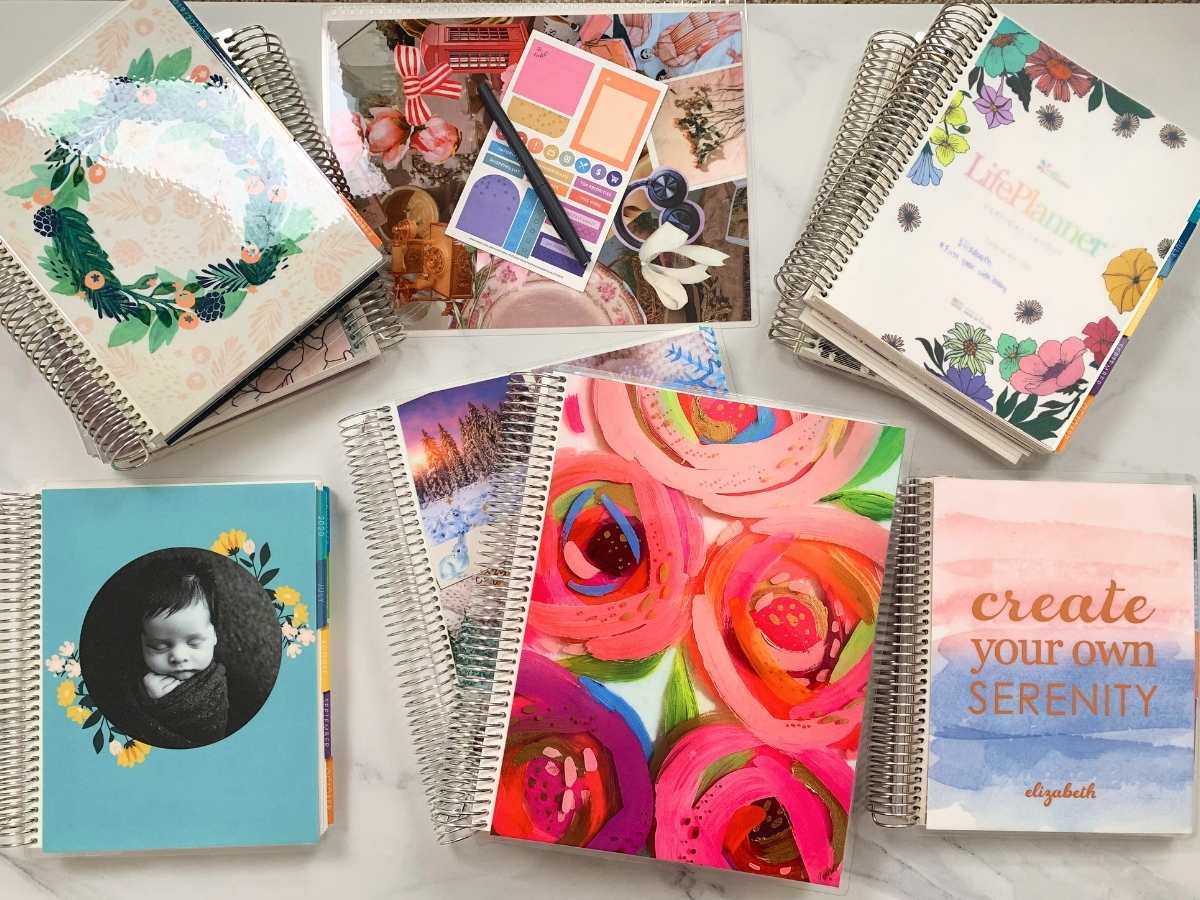 A picture of many Erin Condren planners including multiple copies of their Life Planner, the Daily Duo, and the Teacher Lesson Planner