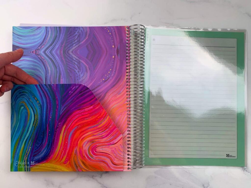 A view of both the paper folder and clear plastic folder at the back of the planner