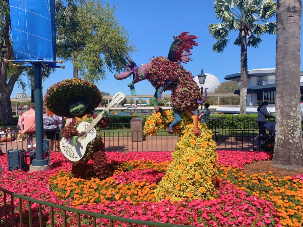 Disney topiaries from the movie Coco, including Miguel playing a white guitar and his dog.