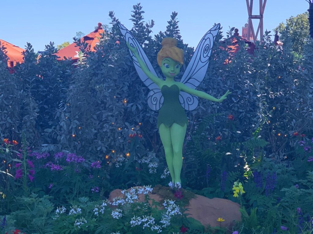 TInker Bell topiary in a twinkling fairy gardem